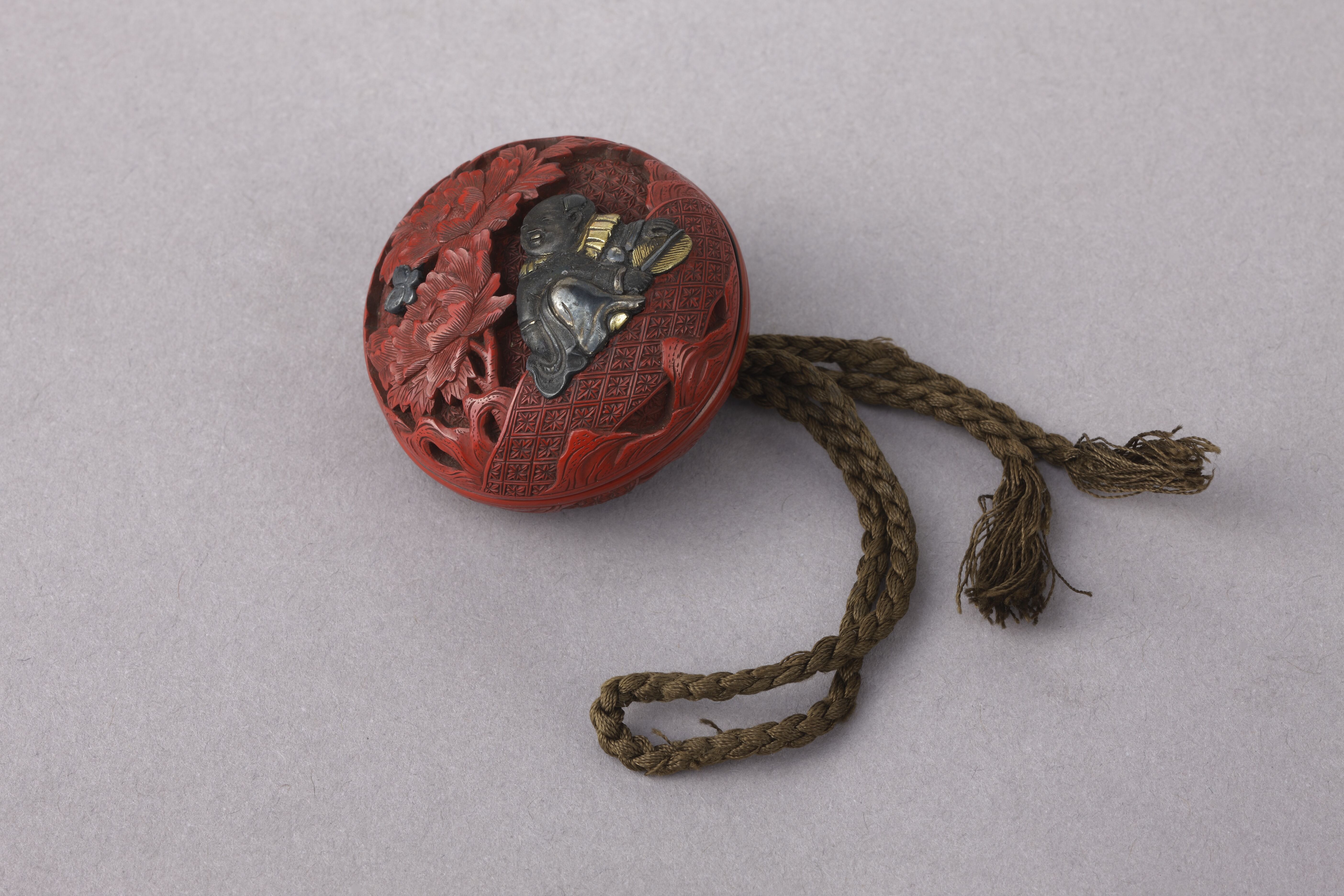 Karako and peonies Manjū netsuke