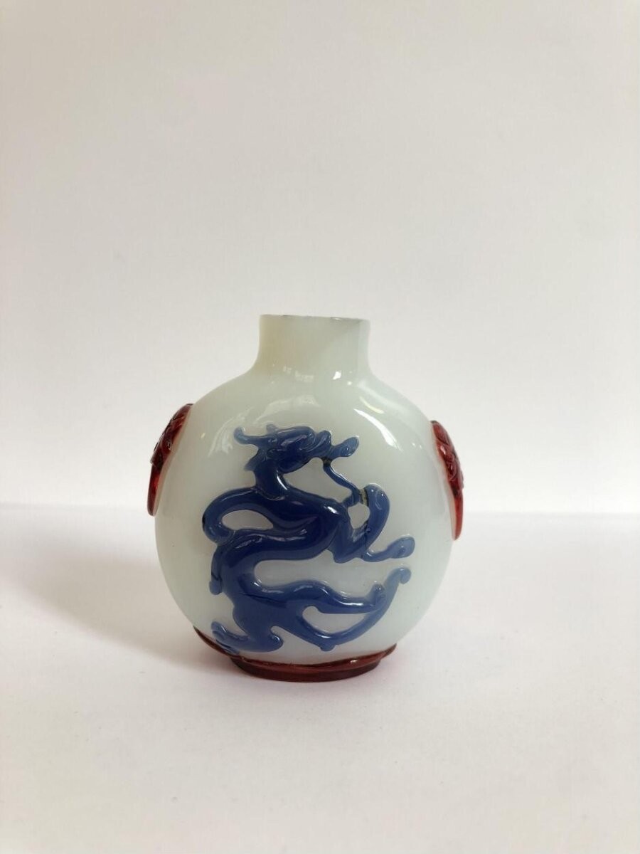 Opaque white glass snuff bottle, decorated with overlay of blue and red glass, China, 1821-1895
