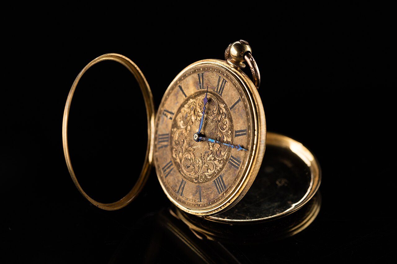 Open-face gold pendant watch