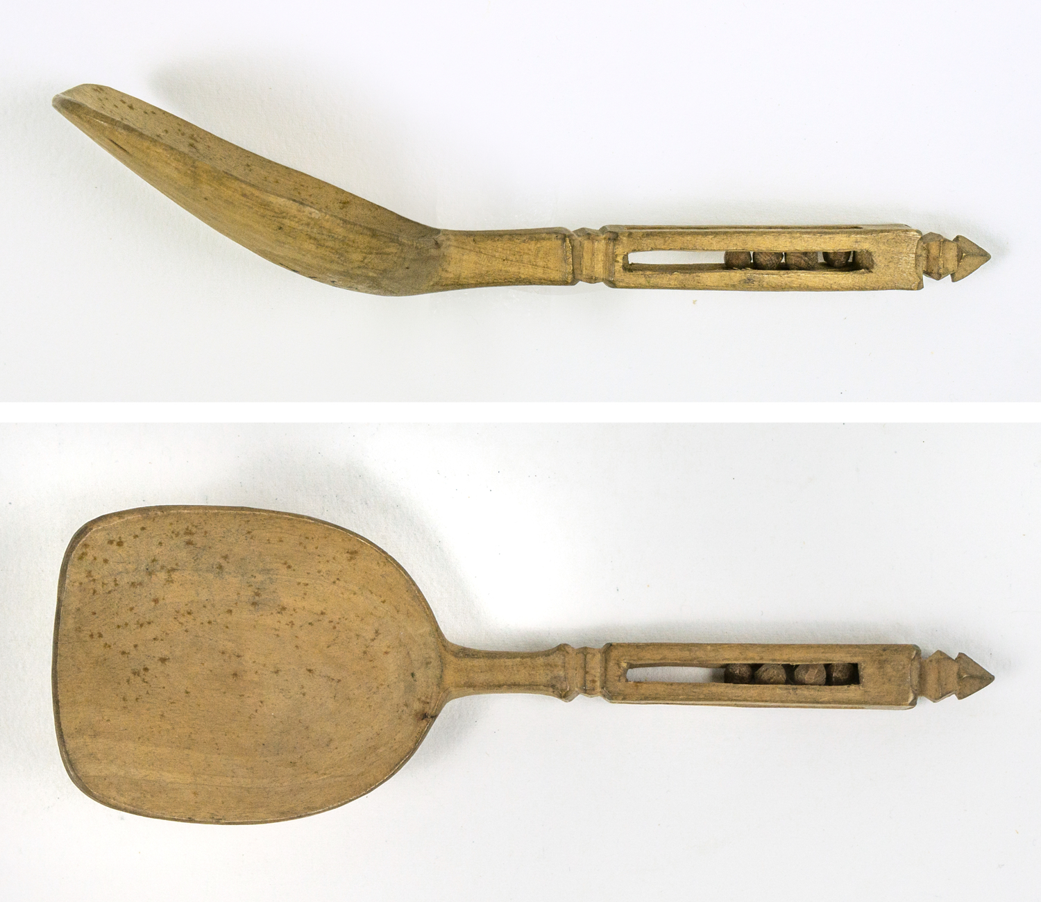 Carved wooden spoon provided with a cavity with four balls, a suitor's gift, a so-called "känning"