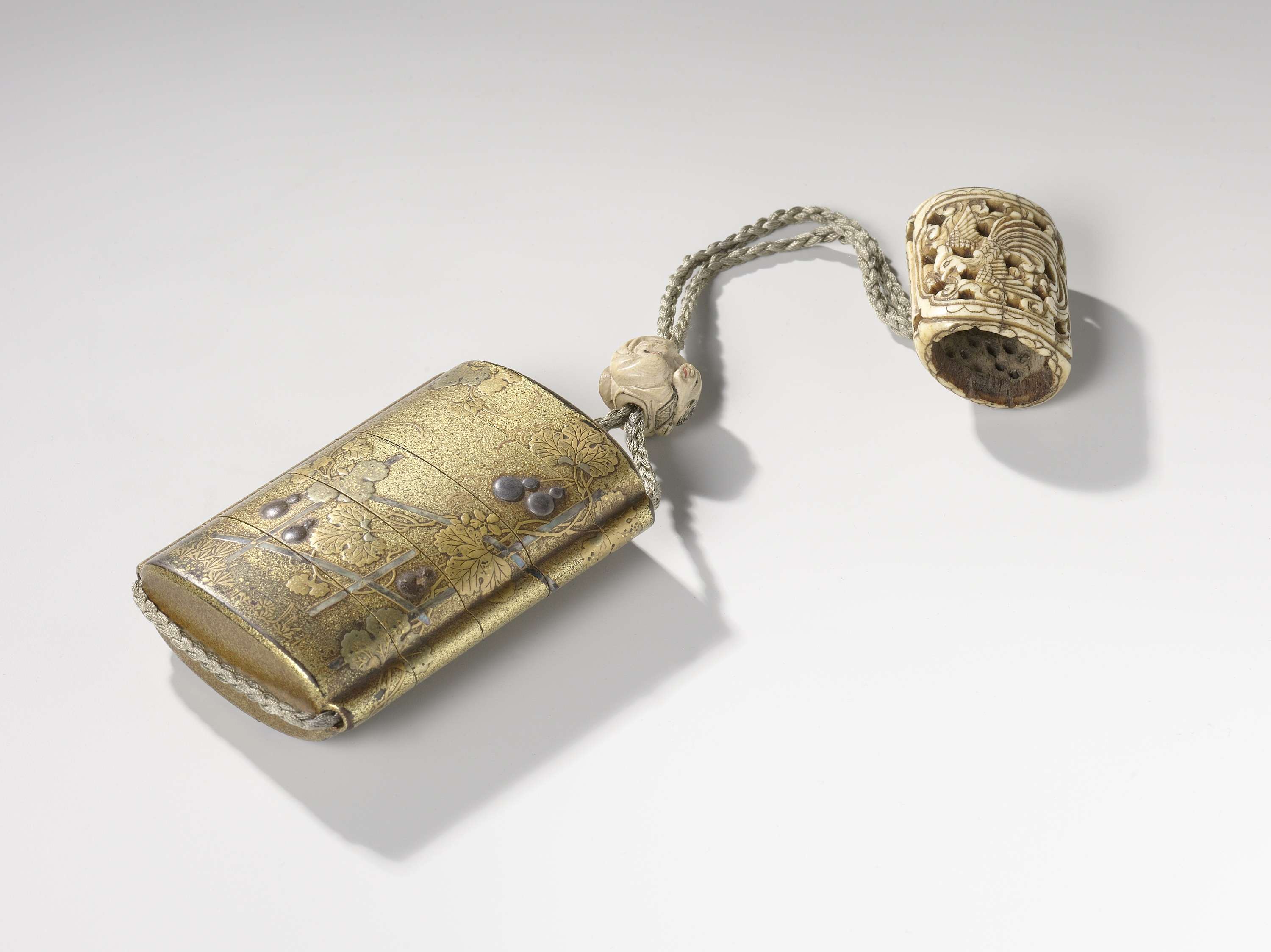 Inro with gourd plant, netsuke with phoenix, ojime with boy and moon
