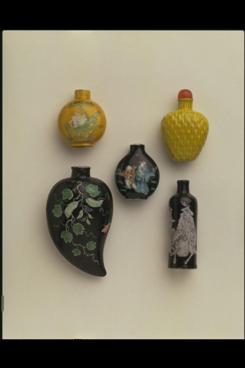 Chinese snuff bottle; 1796-1909, Qing Dynasty; porcelain with painted black ground and painted decoration.