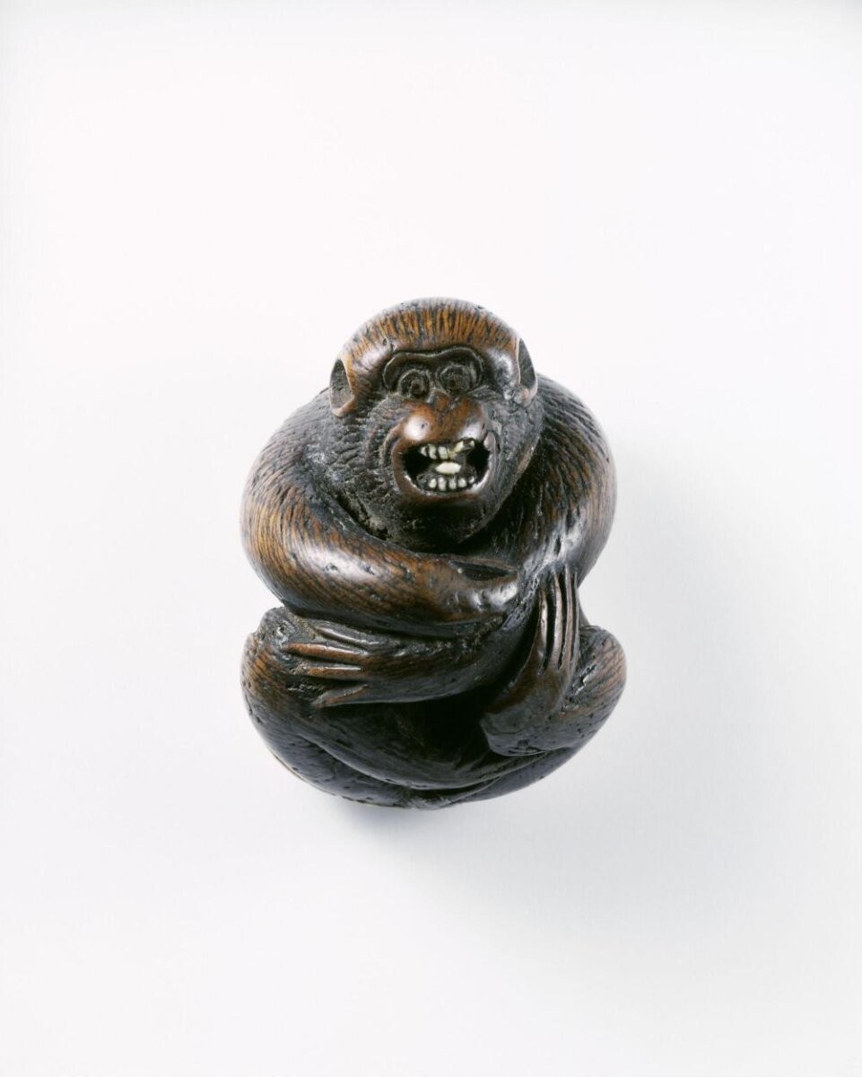 Netsuke, carved wood and ivory, monkey, signed 'Miwa' and 'repaired by Koku', 19th century