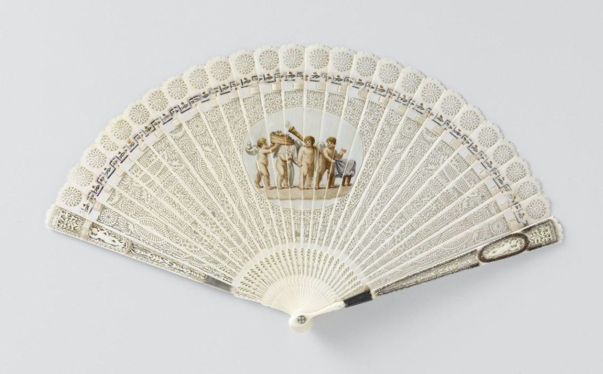 Brisé fan of carved ivory, with a central medallion on which the marriage of Cupid and Psyche is painted in watercolour, steel and silver decoration on the guard sticks