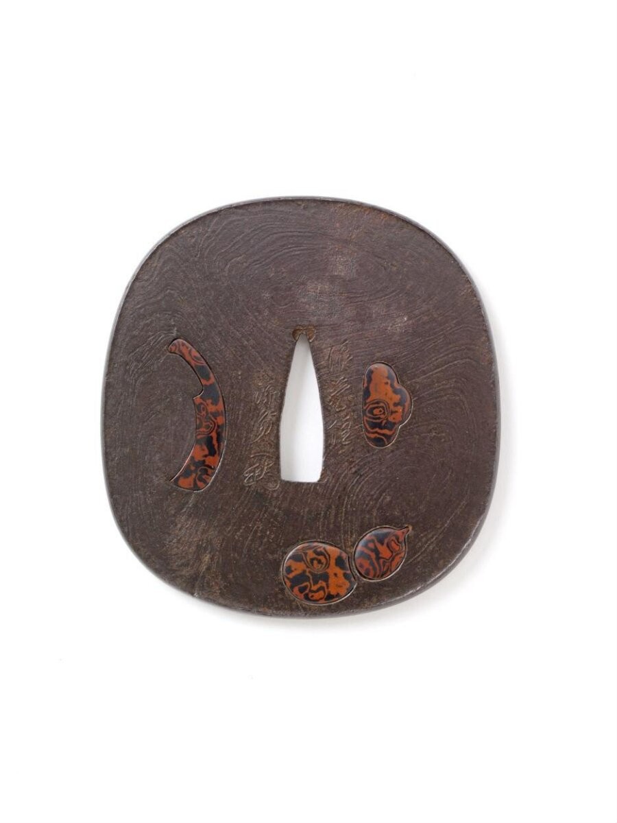 Sword guard (tsuba) decorated with a gourd and kitchen knife. Signed ‘Minamoto Sadakazu of Naniwa' [Osaka] ’and ‘Keiō 2, tiger year, early spring [1866]’.