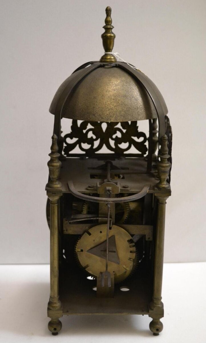 Lantern clock of engraved brass. Made by William Goodwin of Stowmarket, Suffolk, late 17th century