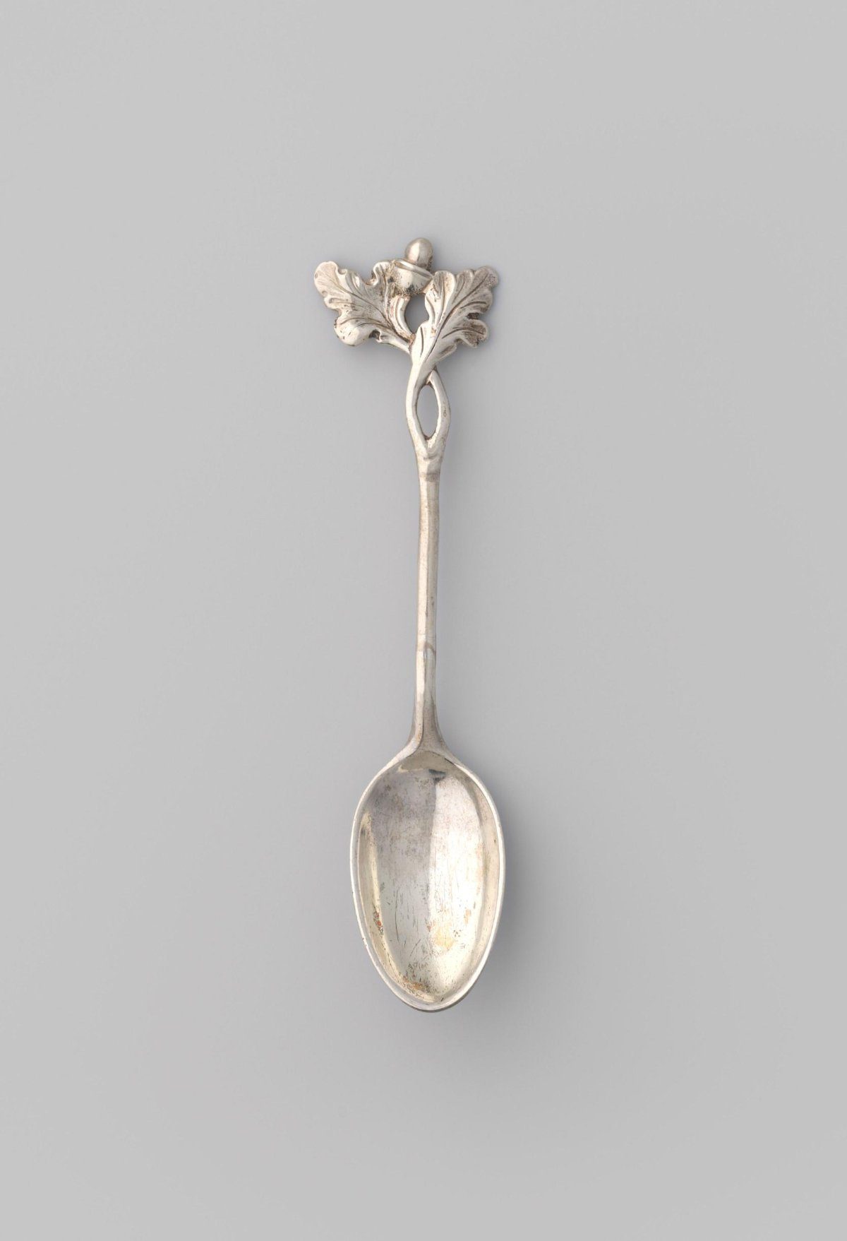Jam spoon with oval bowl and stem ending in oak leaves