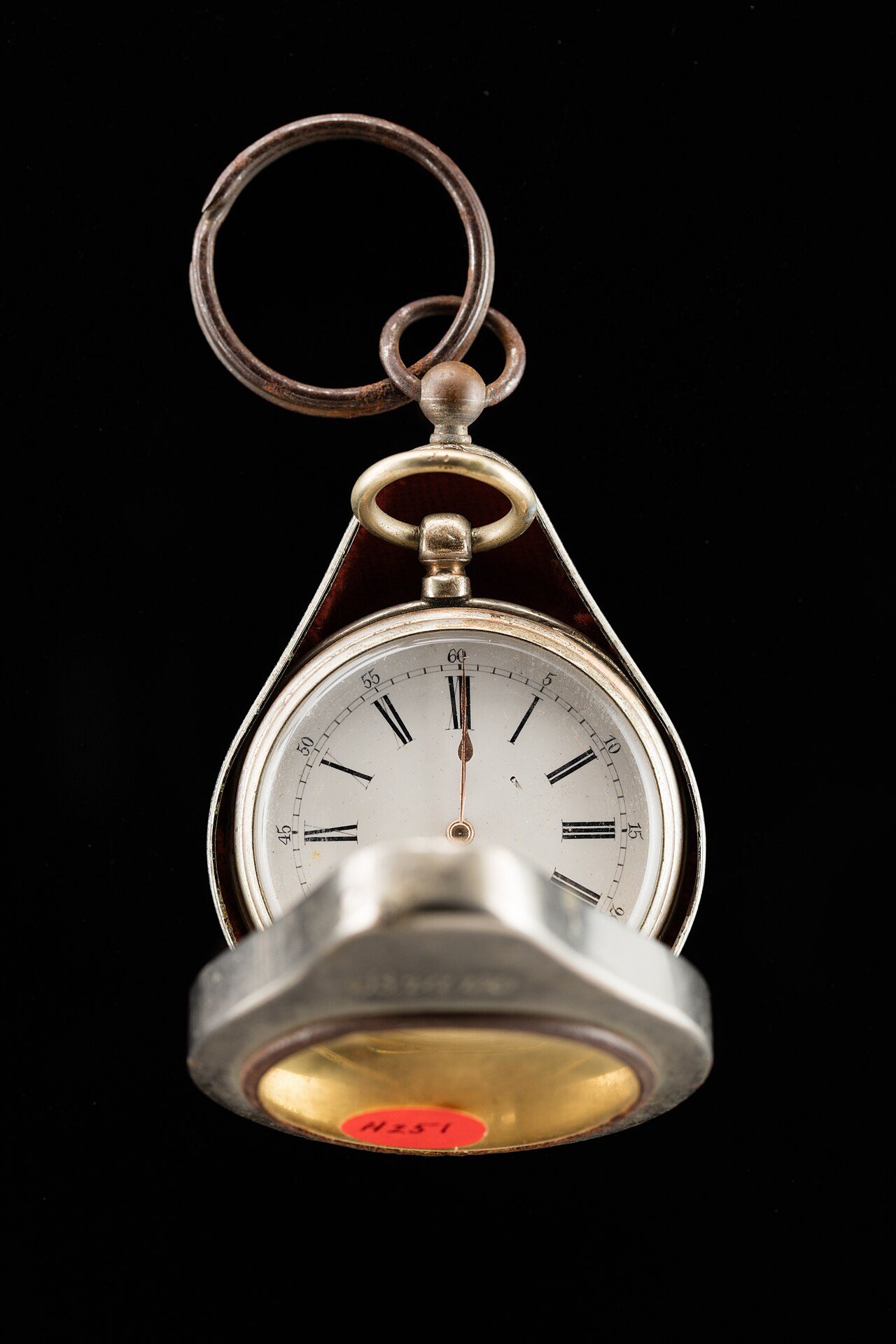 Open-face silver cylinder pocket watch with outer case