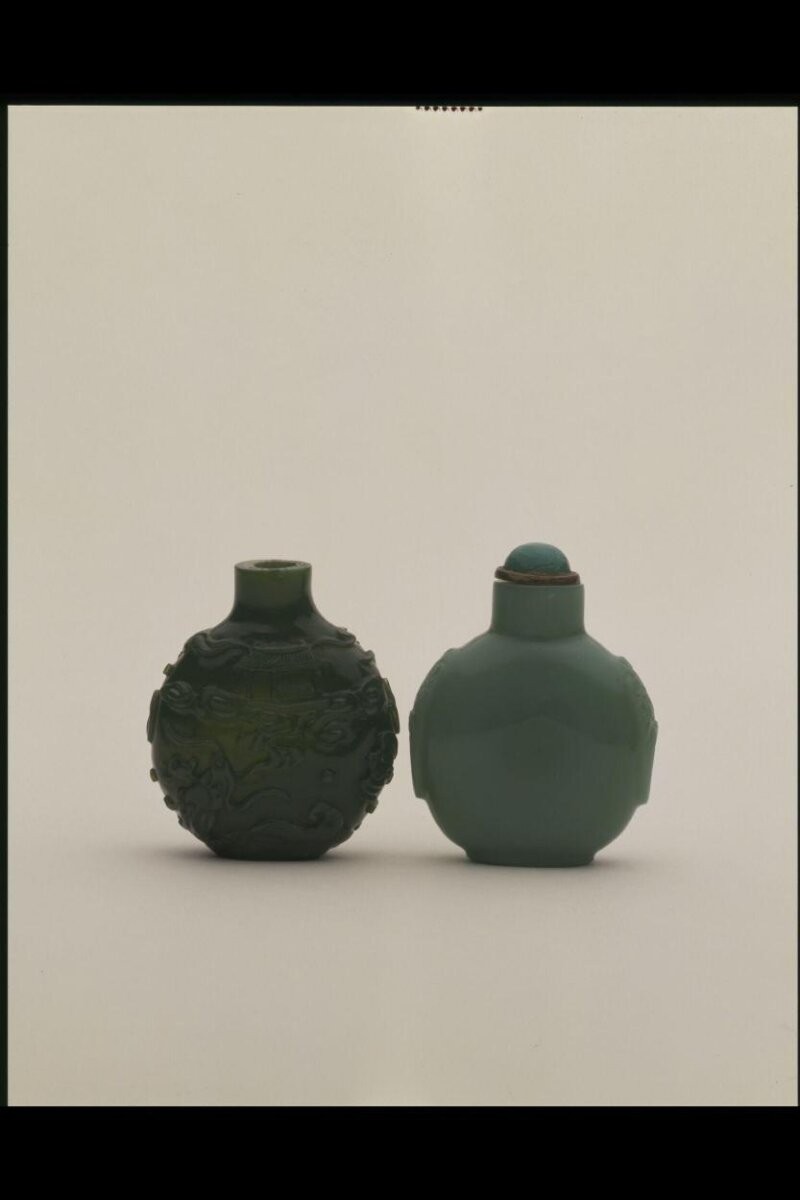 Snuff bottle, glass coloured green with carved decoration in relief, China, 1750-1850