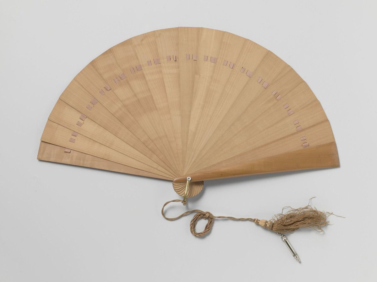 Brisé fan, for use as a dance card, of wood with a copper fan ring holding a silk cord with pencil in a nickel holder