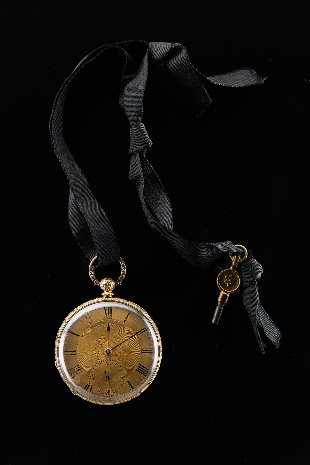 Lady's 18 ct. gold open-face pocket watch with key
