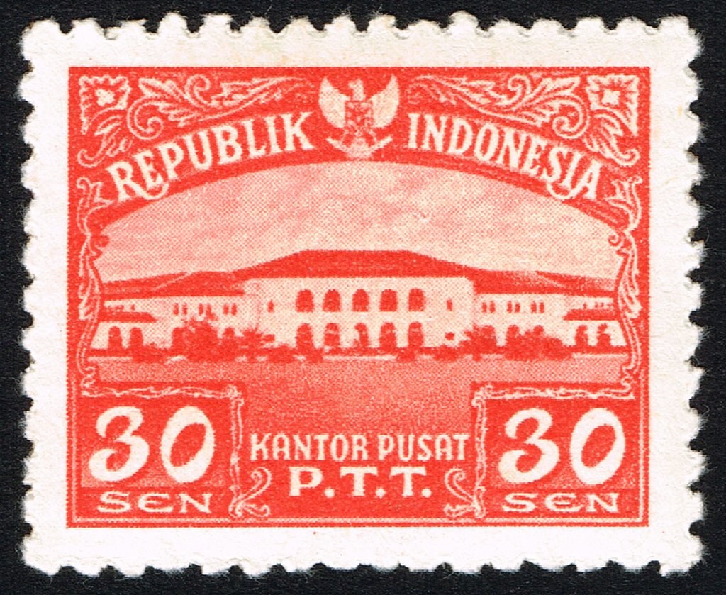 Photograph of a stamp from this issue (Wikimedia Commons file “Stamp of Indonesia - 1953 - Colnect 261264 - General Post Office Building.jpeg”). The paper, perforation or watermark variety shown cannot be confirmed from the photograph.
