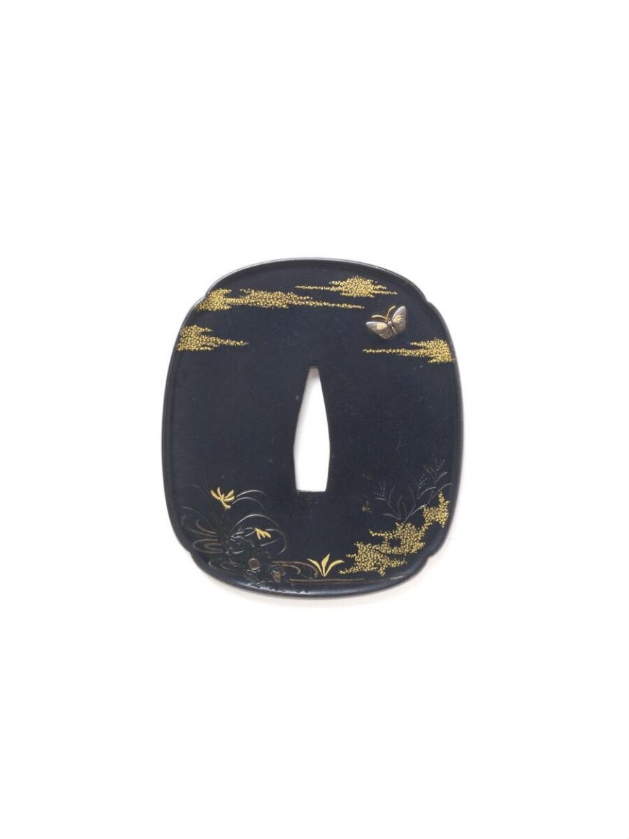 Sword guard (tsuba) decorated with a stream with plants and a dragonfly and butterfly in a stylised cloud haze