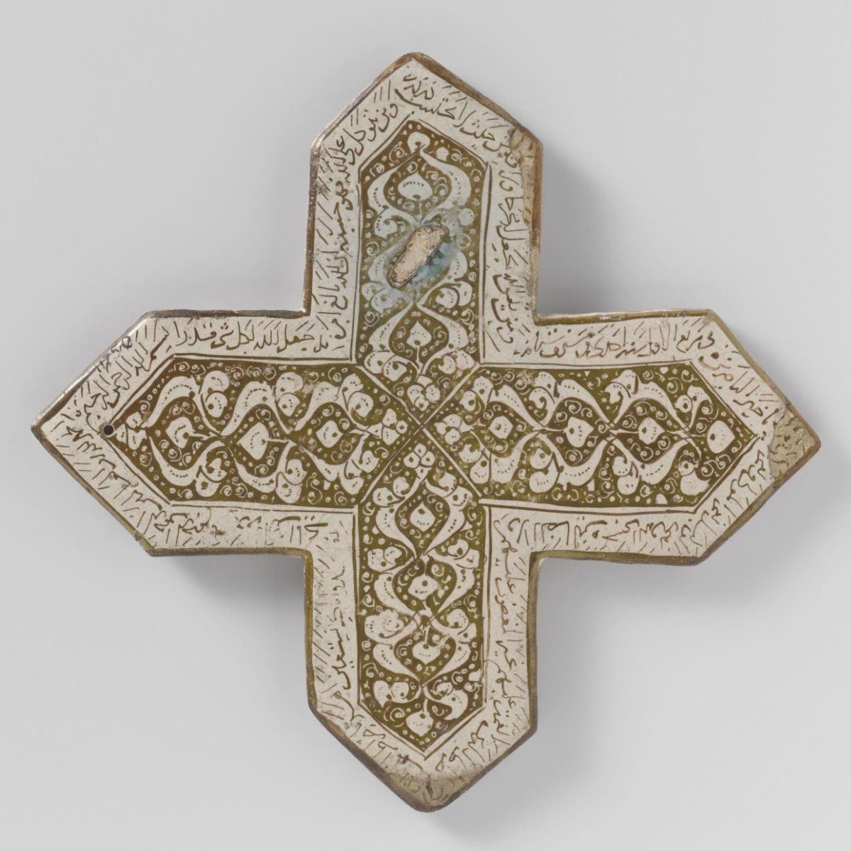 Cross-shaped tile with Quranic texts and scrolls