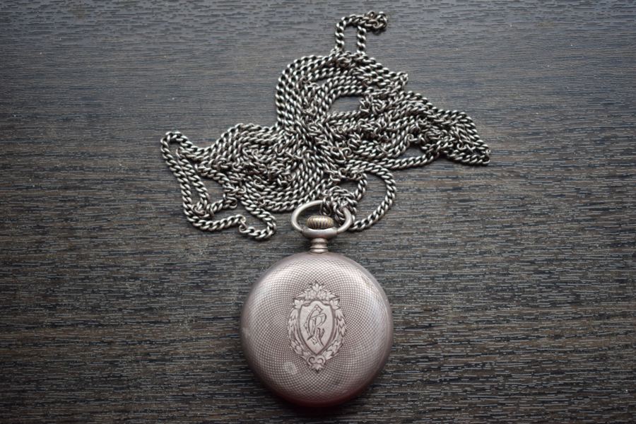 The silver-made Omega pocket watch presented by General Henri Berthelot to Father Constantin I. Roșescu, a Romanian Orthodox priest and teacher from Iași, that became his friend during the WWI French campaign in Romania. The backplate is engraved with "CR", Roșescu's initials. Fa