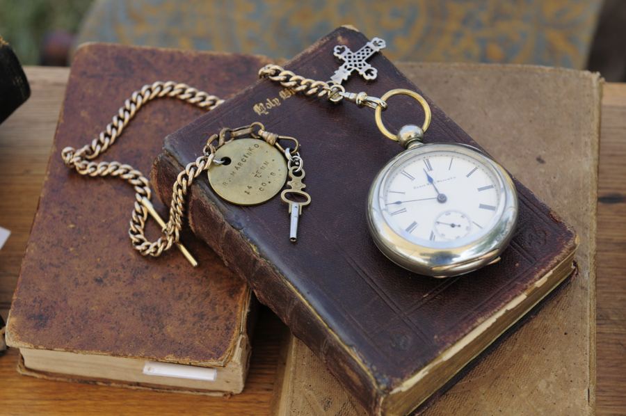 Close up on a pocket watch and books in the living history area